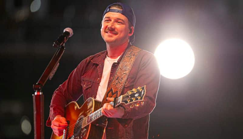 singer Morgan Wallen arrested for throwing a chair off from roof top bar 