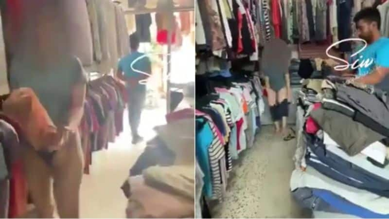 Woman strips and tries clothes in front of male shop keeper in Delhi AKP