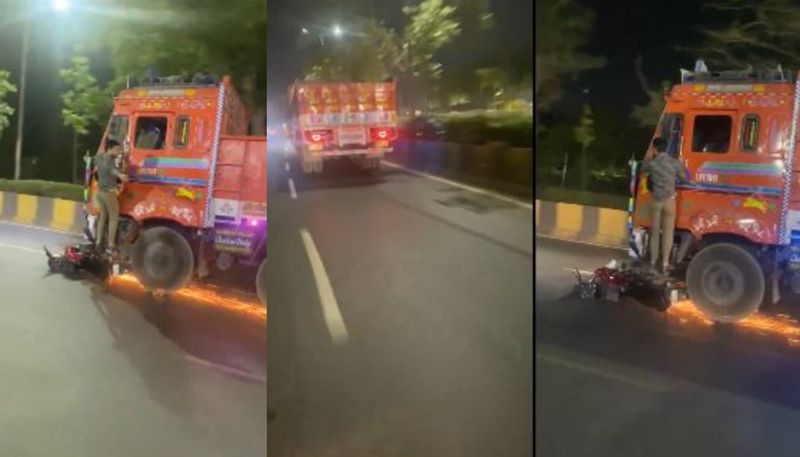 lorry speeding away after accident with passenger in footboard and bike under front tyre 