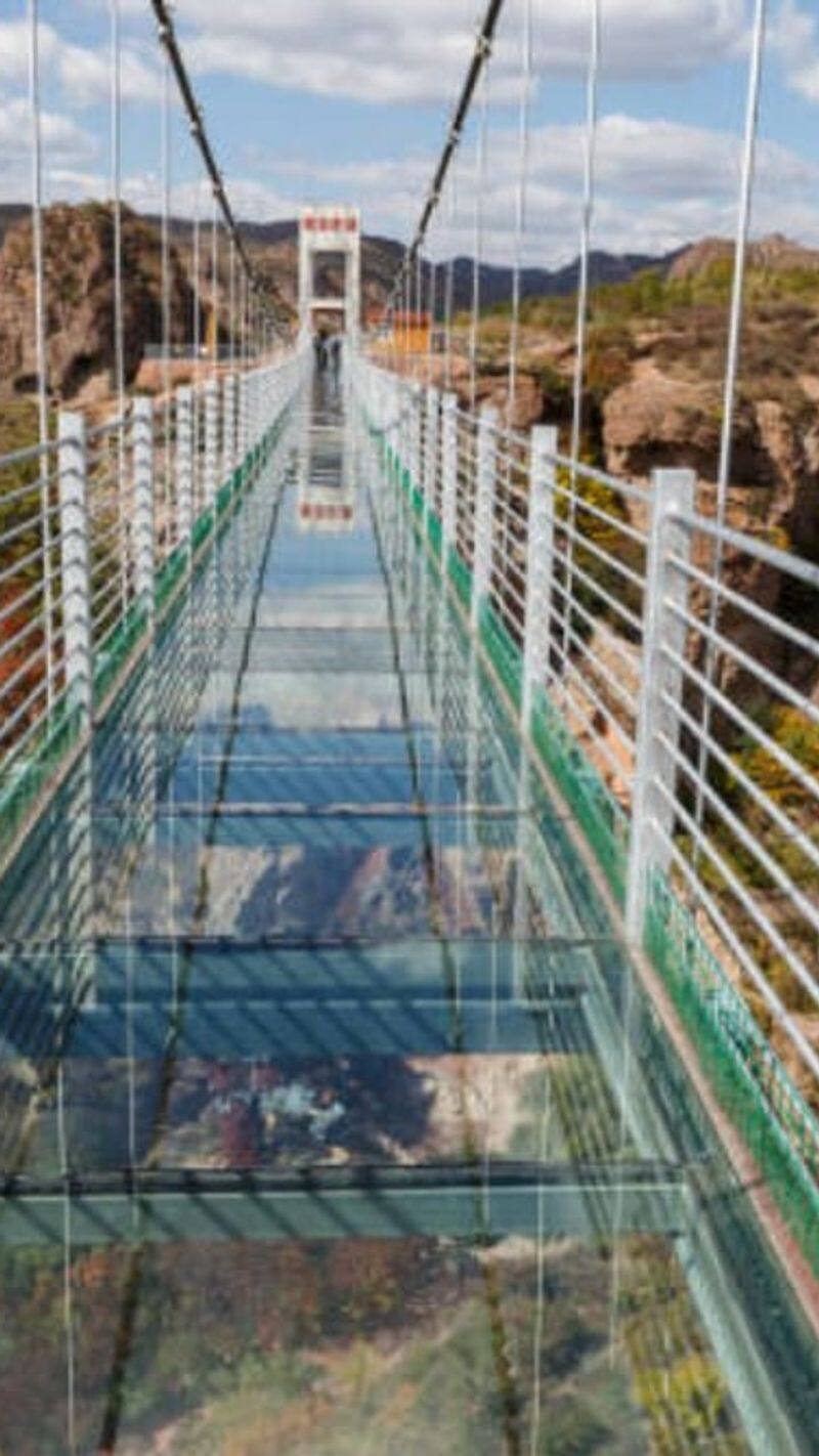 Which is the longest glass sky over bridge in the country Chitrakoot or Kerala? XSMN