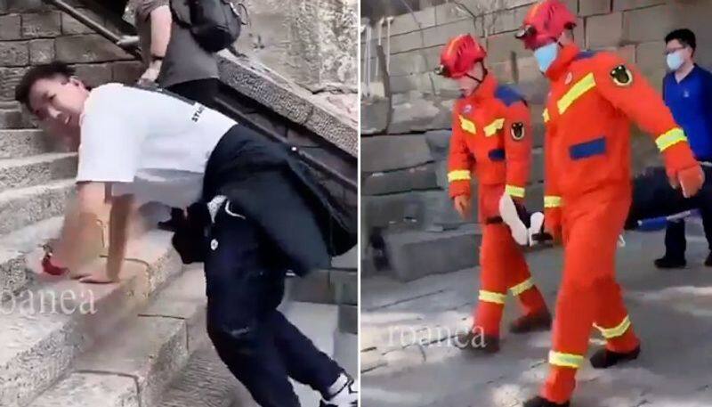 Bizarre Viral video shows people in China struggle with 'jiggly' legs after 6600 steps climb (WATCH) AJR