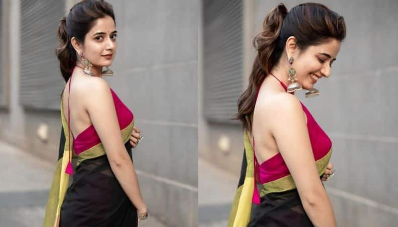 acress Ashika Ranganath stuns in backless blouse and black saree pav