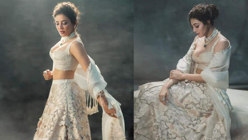 kajal aggarwal gorgeous glamour photoshoot in white lehenga vvk