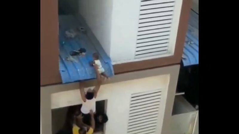 Video of rescue of child who falls from apartment in chennai smp