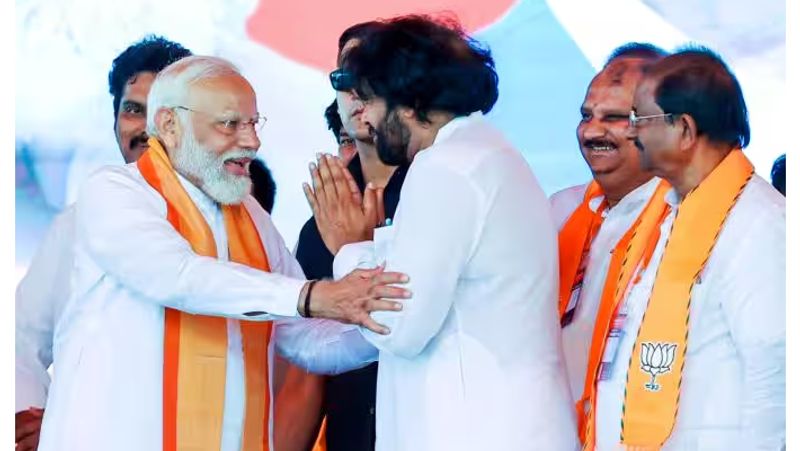 Pawan Kalyan touches PM modi feet during lok sabha election campaign in andhra pradesh gan