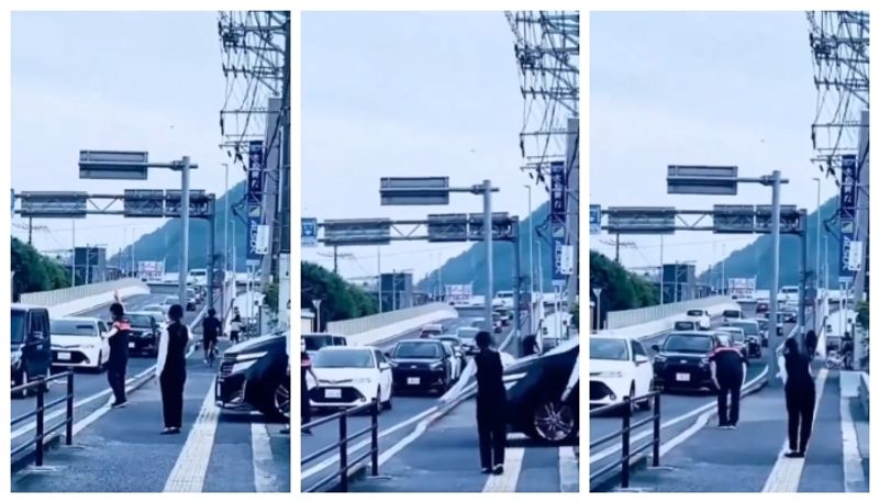 video of a Japanese man thanking vehicles after blocking traffic to pass the van has gone viral 