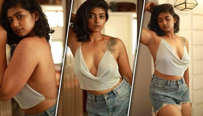 SEXY photos Kannada actress Bhoomi Shetty dons bold backless white shimmer top with denim shorts RBA