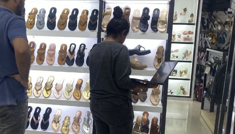 Bengaluru: Viral photo shows woman attending team meeting on laptop while shoe shopping, Internet reacts vkp