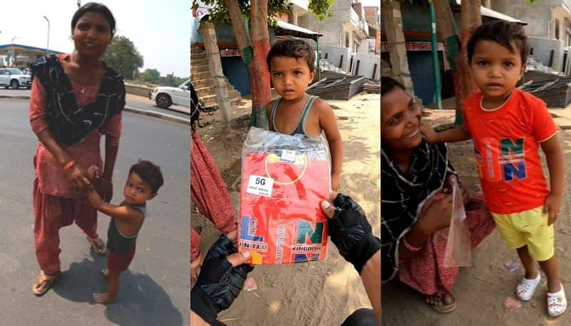 kind hearted biker gave shoes clothes to  child who crossing road barefoot san