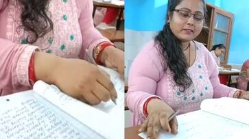 WATCH: Viral video of Bihar teacher checking answer sheet without reading; FIR registered RTM