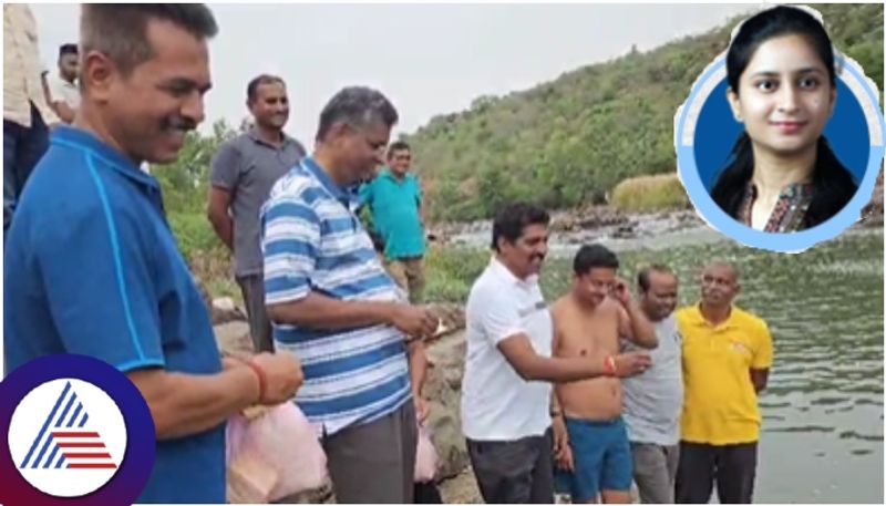 Minister satish Jarkiholi put food to fish in Belgavi markandeya river sat