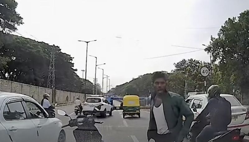 Bengaluru Biker smashes car windows with coconut shell in broad day light, caught on camera (WATCH) gcw