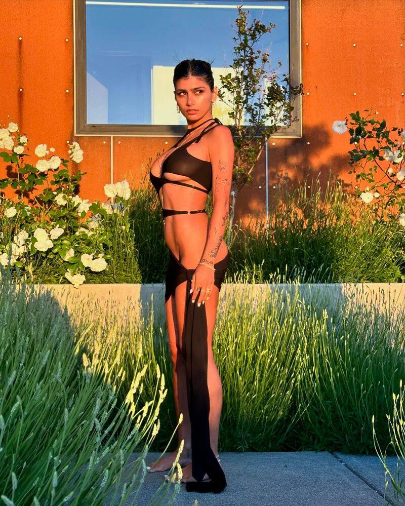 Mia Khalifa Shines in cut out dress fans ask whats the point of even wearing it san