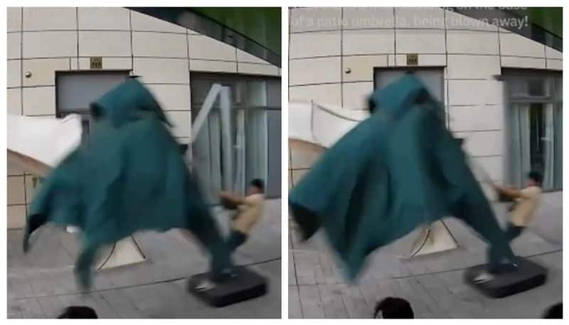 Video of man flying in strong winds goes viral 