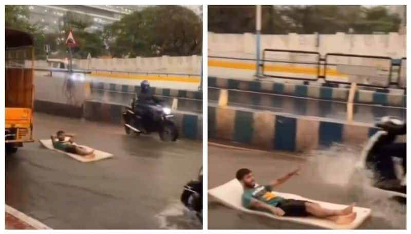 Social media reacts sharply to a man by surfing in waterlogged areas of the road