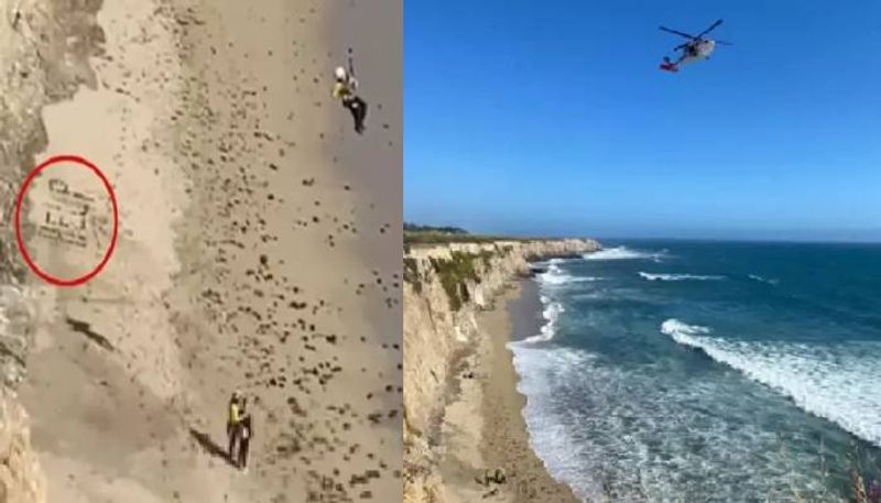 kite surfer stranded on a remote beach wrote help with rocks rescued 