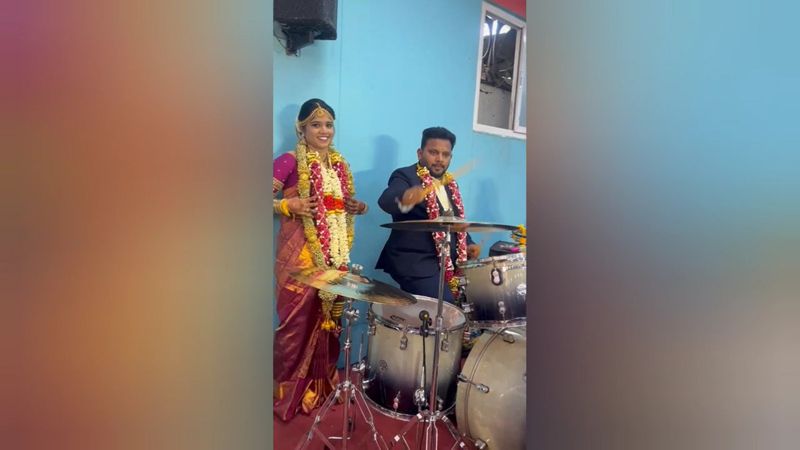 newly married person playing drums at wedding event in madurai vel