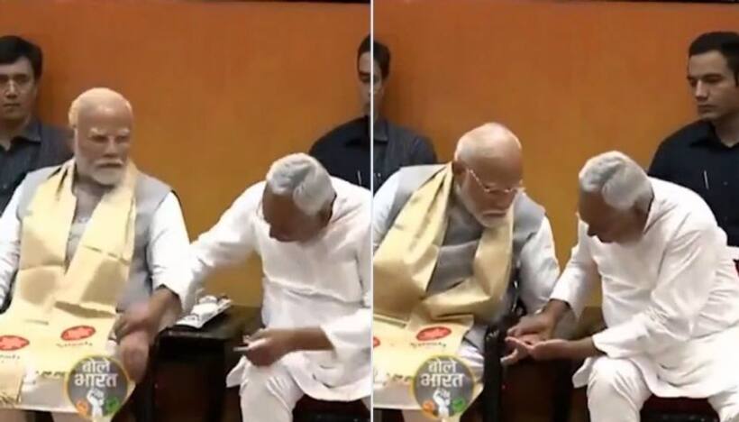 What is Nitish Kumar checking? Internet abuzz as Bihar CM checks PM Modi's hand in surprise move (WATCH)