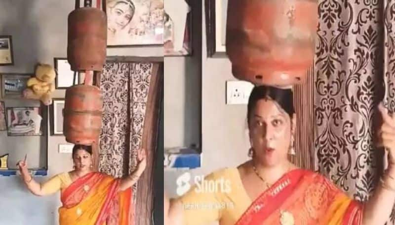 woman dancing with two gas cylinder in her head viral video  