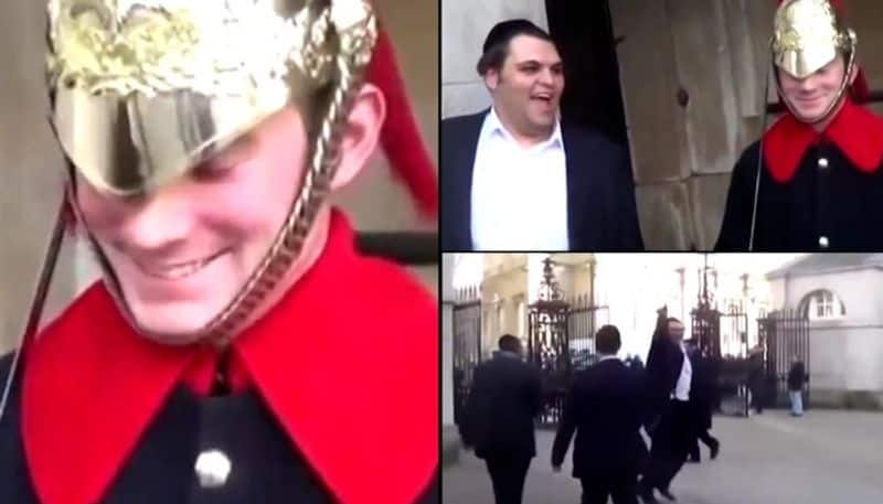 Rare moment shows Buckingham Palace visitor cracking Royal Guard's stiff upper lip! (WATCH) AJR