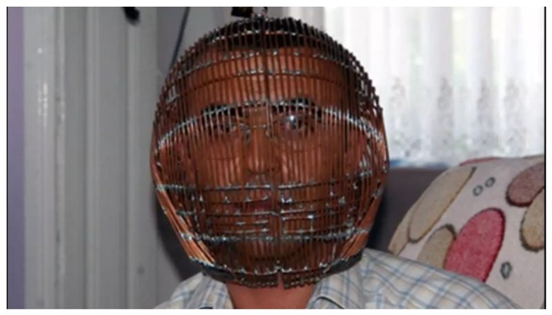 man with his head locked in a cage for eleven years to stop smoking 