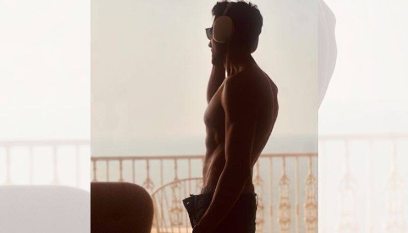 bollywood  actor kartik aaryan shares shirt less photo mrq