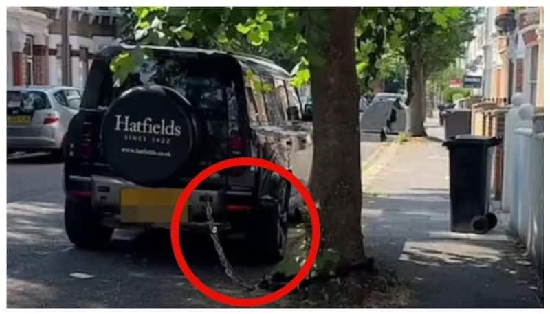 video of a Land Rover chained to a tree in London street has gone viral on social media 