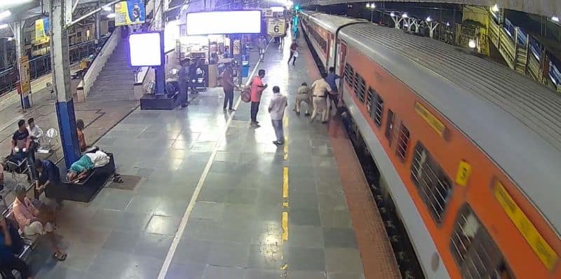 man gets narrow escape to life after trapped in between moving train and platform in palakkad 