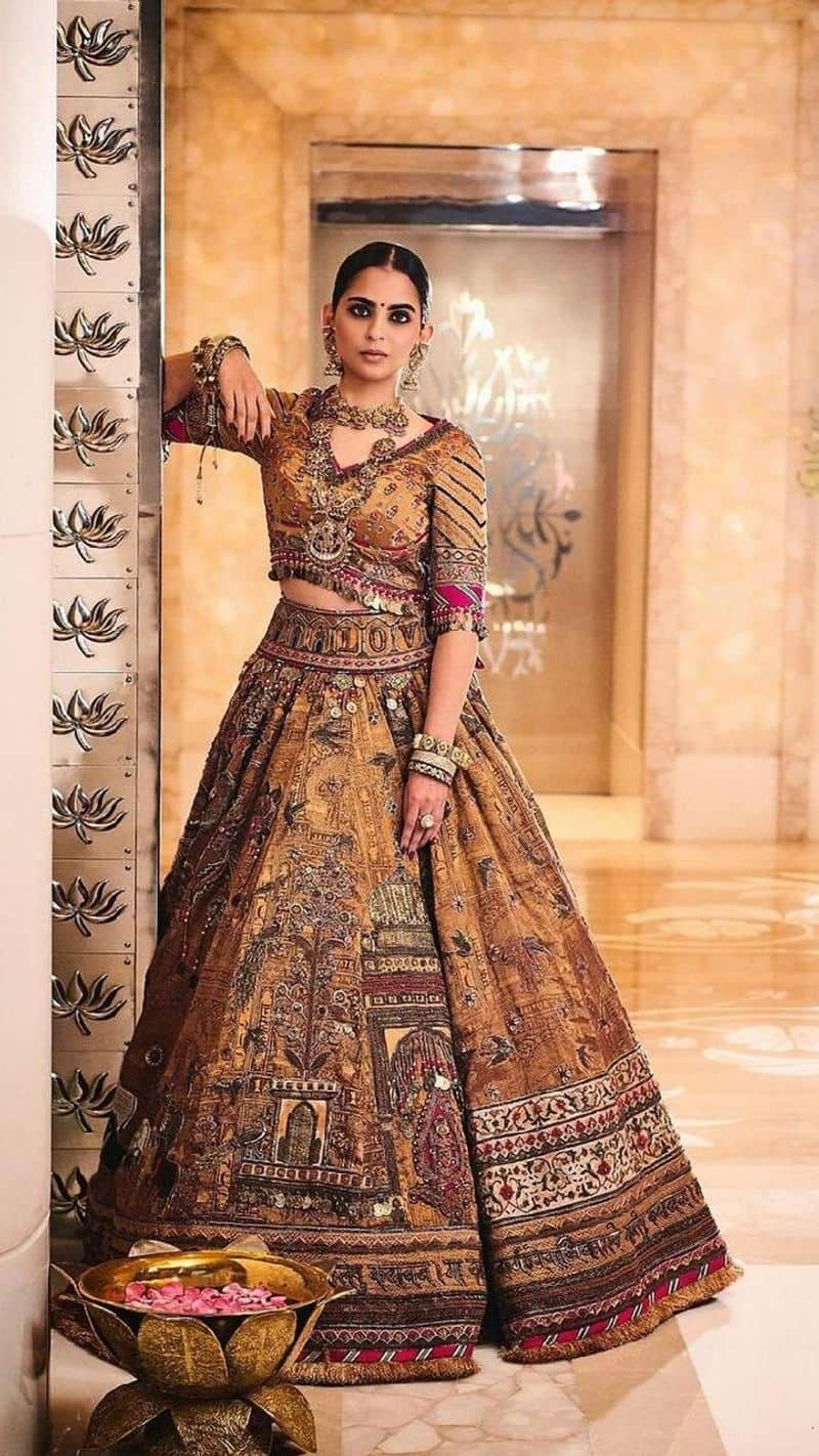 Isha Ambani wear gita  shloka written border embroidery vintage lehenga