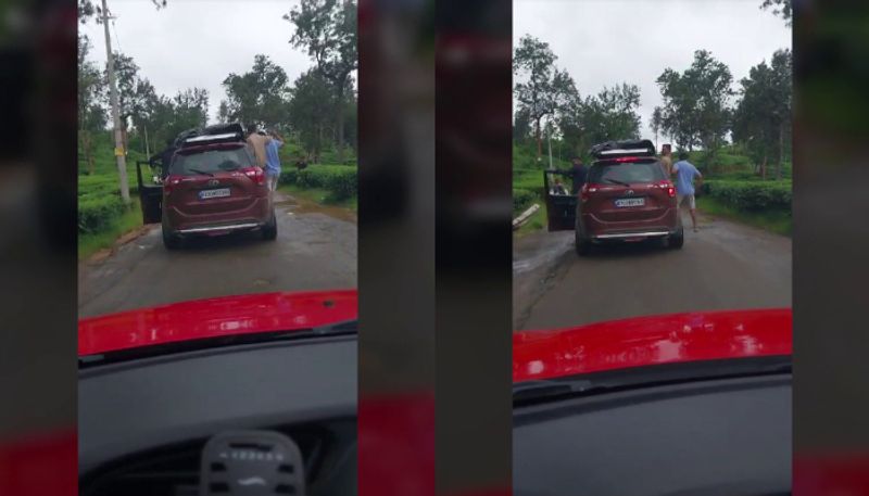 Video of young men dangerous ride hanging from vehicle on bumpy road out in Wayanad