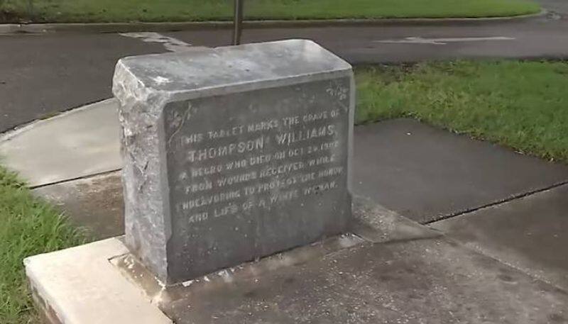 grave site of Thompson Williams in the middle of a sidewalk 