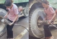 Video of mother fixing truck tire with child on her back goes viral NTI