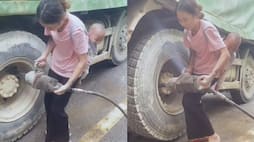 Video of mother fixing truck tire with child on her back goes viral NTI