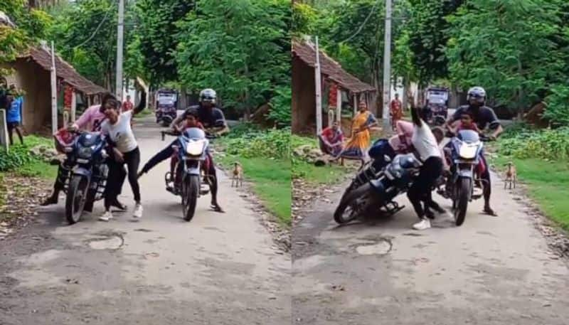 woman dancing in road man fell from bike viral video 