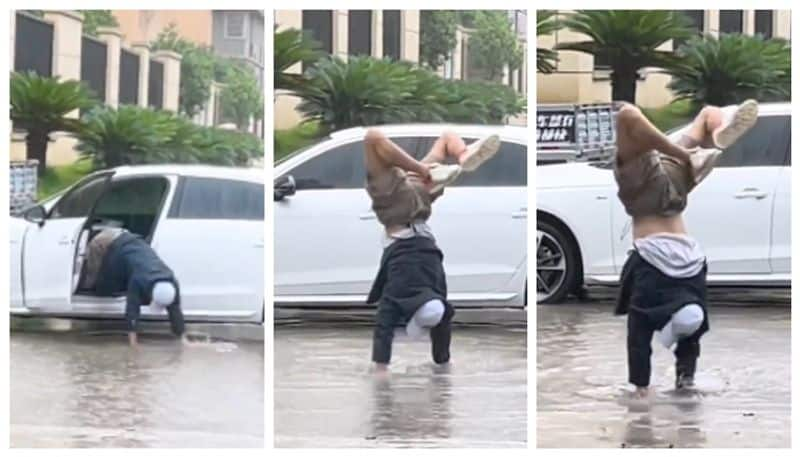 video of a man trying to keep his shoes from getting wet has gone viral on social media  