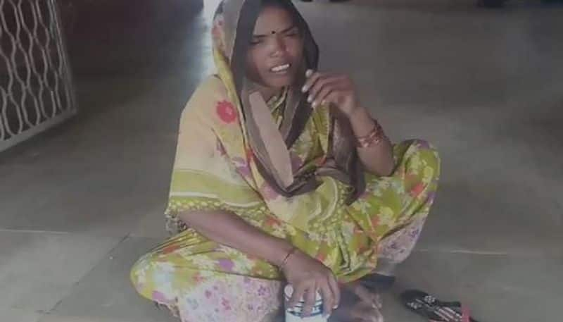 woman holding bottle of poison protested in front of sindagi Tahasildar's office in vijayapura grg 