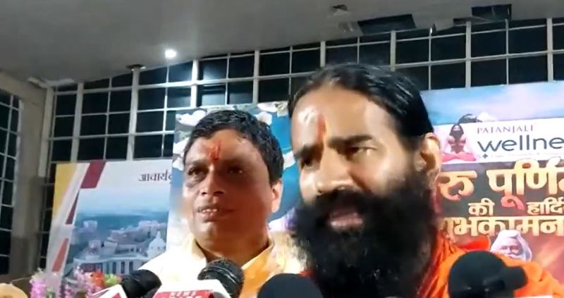 Baba Ramdev responds a controversy about owner name Mandatory in hotels board in kanwar yatra route akb