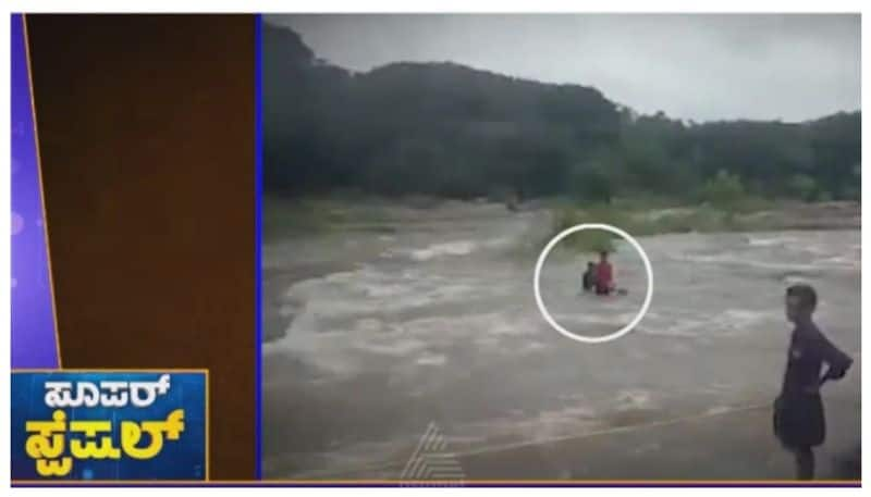 boys in middle of flood of river at kerala nbn