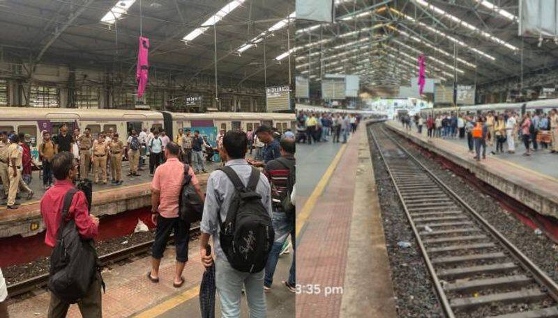 man throw raincoat for friend train delayed in mumbai 