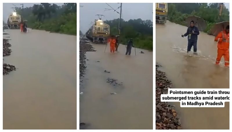 pointsmen along the submerged rail tracks Followed by the train Video from Madhya Pradesh goes viral 