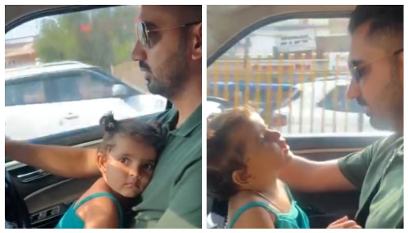 Social media criticize the video of a man drive the car with her daughter sitting on her lap 