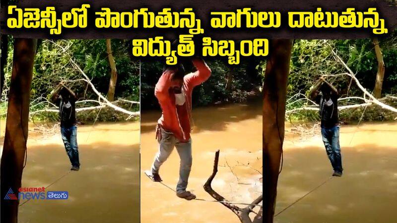 Power personnel crossing overflowing streams in the agency