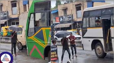 An alcoholic standing in Shivamogga to Thirthahalli main road demand for liquor sat