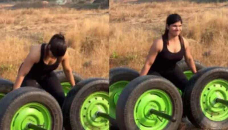 woman lifting four large tyres video went viral 