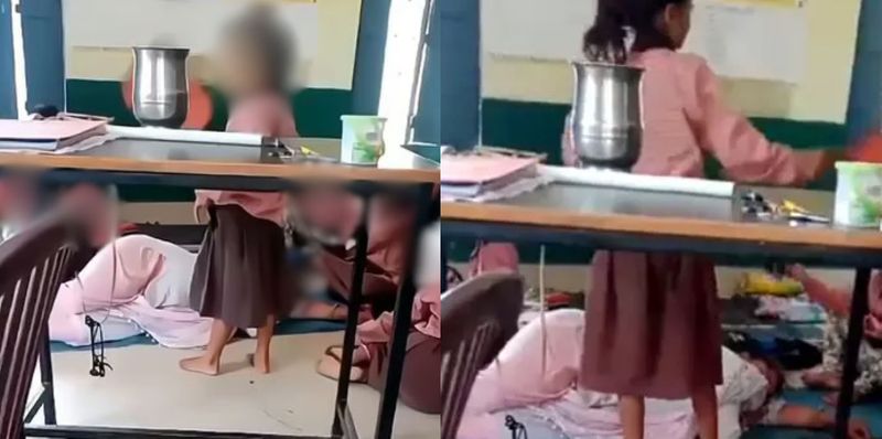 teacher sleeps in classroom as primary school girls fan her video out teacher suspended