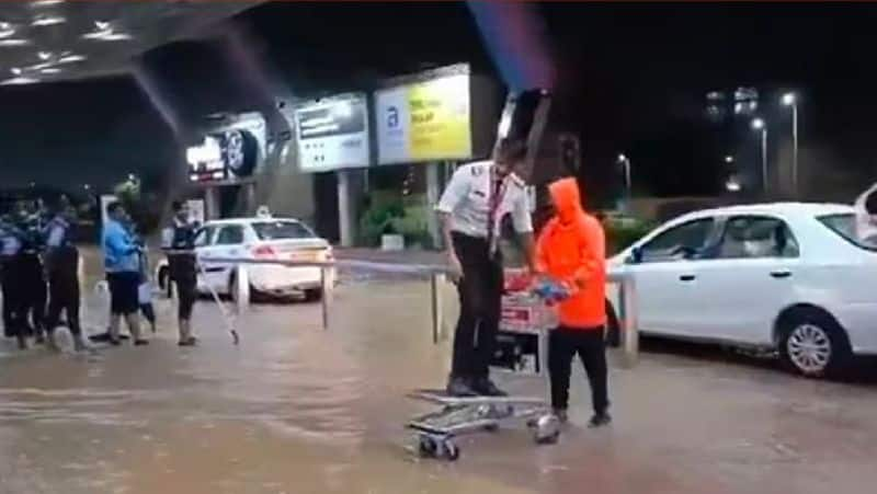 Jaipur Airport hit by heavy rain pilot came airport by trolley cart video viral in social media akb