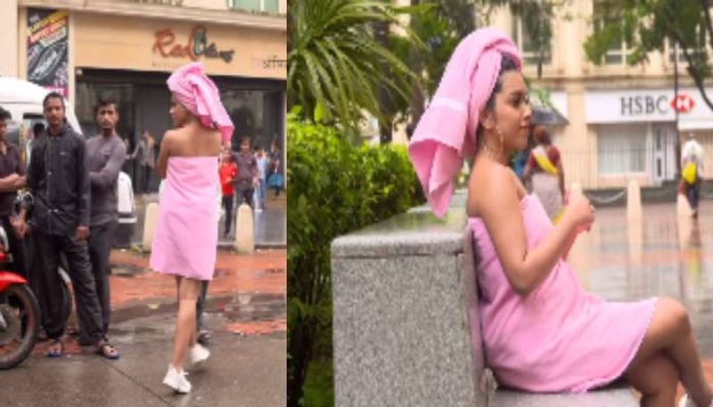 woman wearing towel and walking in the city viral video 