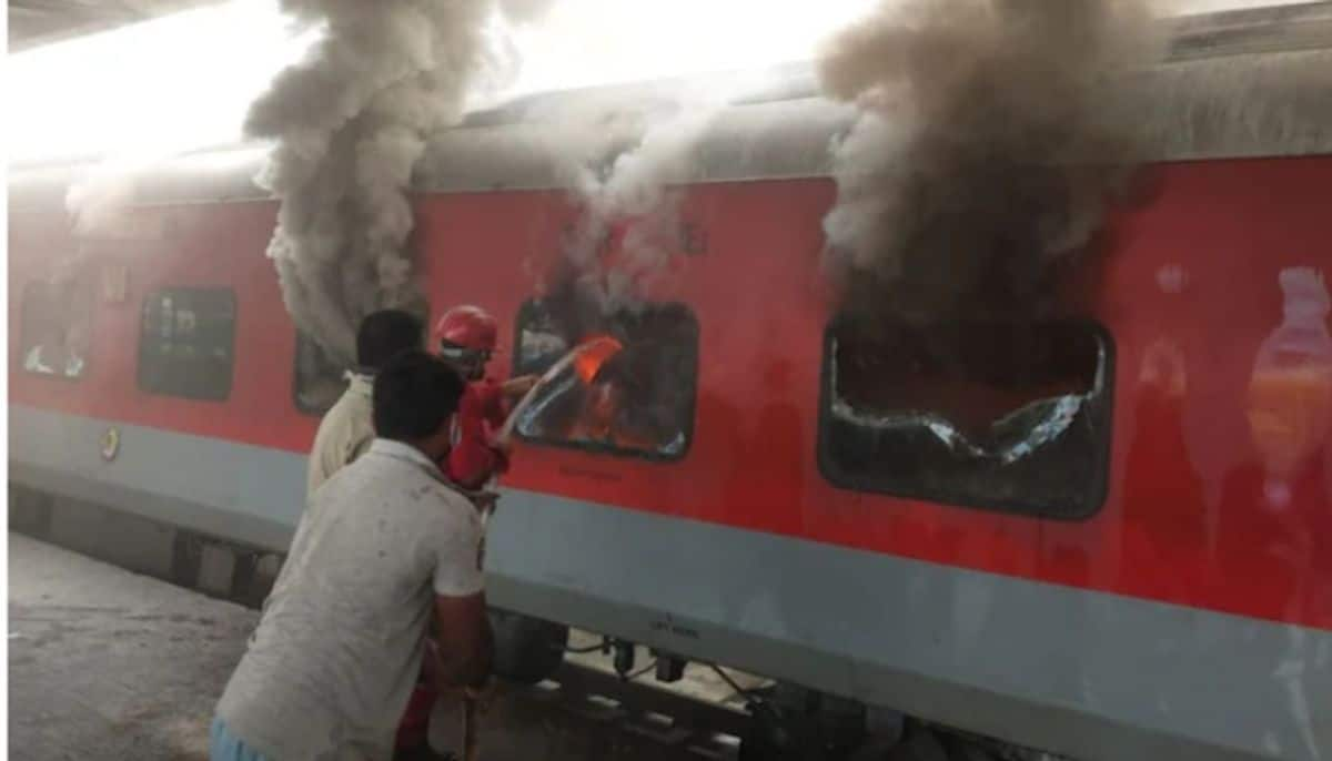 three coaches of a train halted at station gutted in fire and passengers were already went out