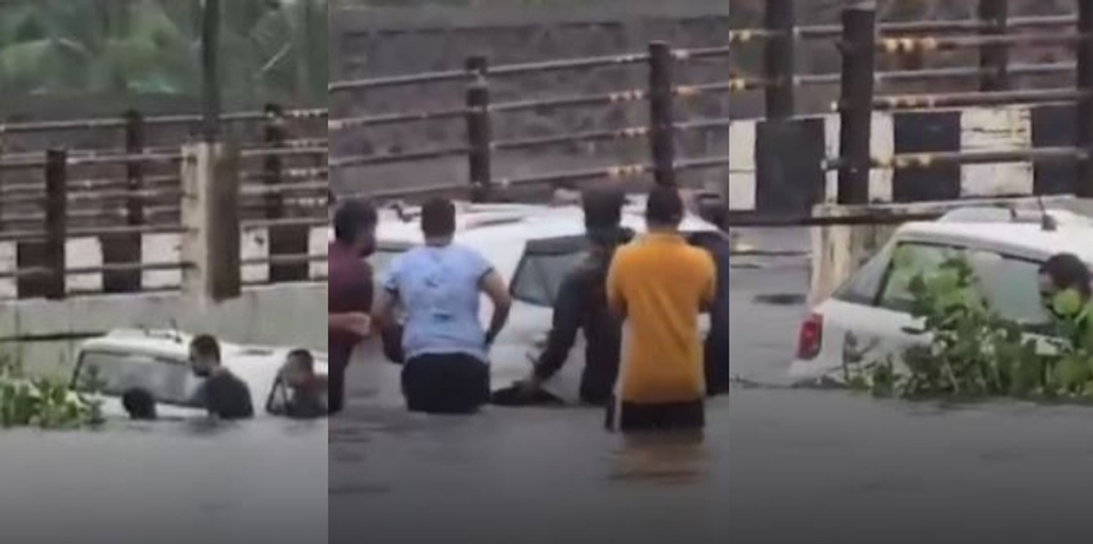 Surat man rescued from 20-feet deep waterlogged bridge car pulled out by locals video