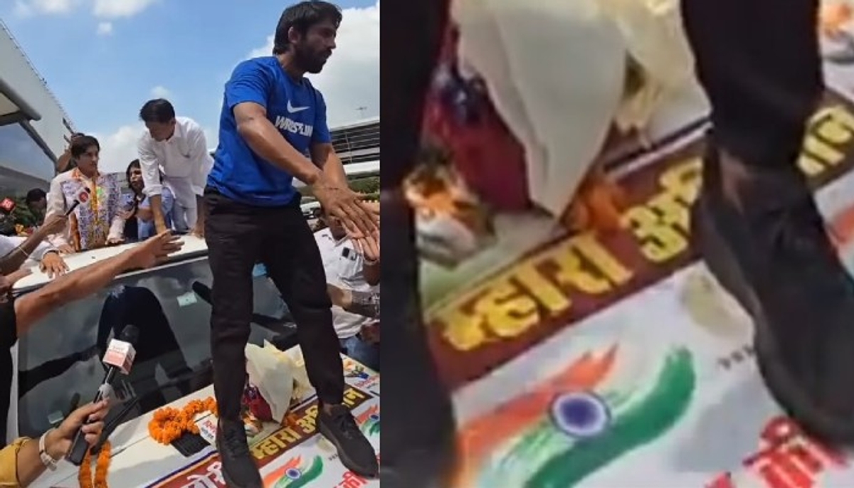 Bajrang Punia Spotted Standing On Tiranga Poster While Receiving Vinesh Phogat In Delhi video goes viral kvn